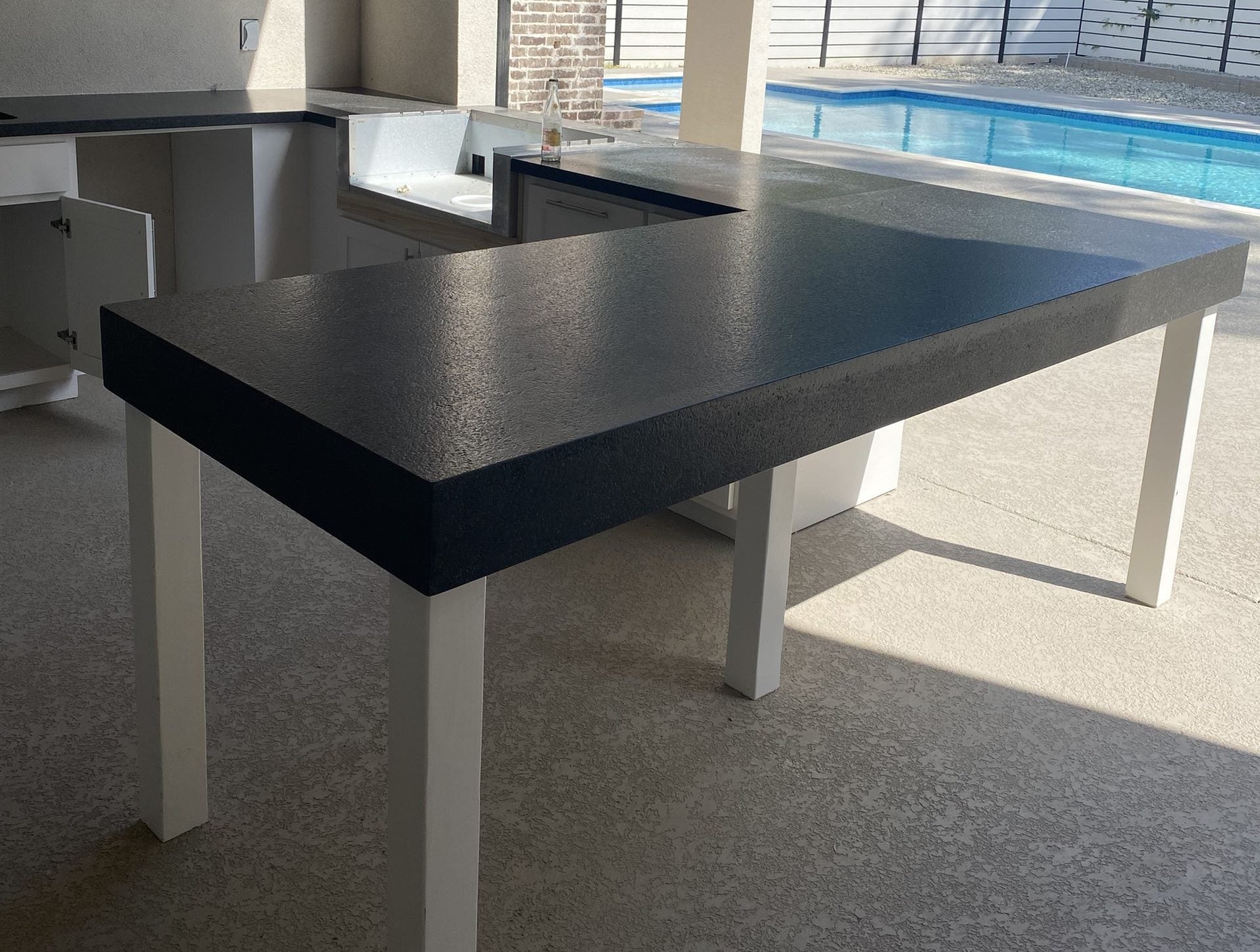 honed black granite countertop installed in outdoor living space