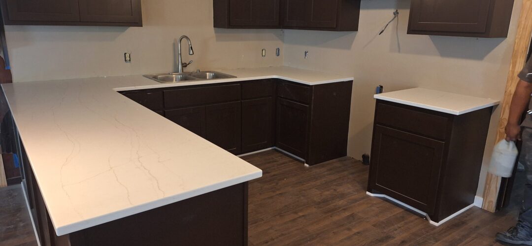 traditional kitchen with white quartz countertops