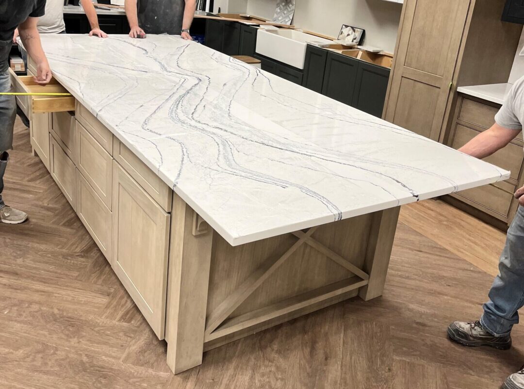 behind the scenes of stone kitchen island being installed