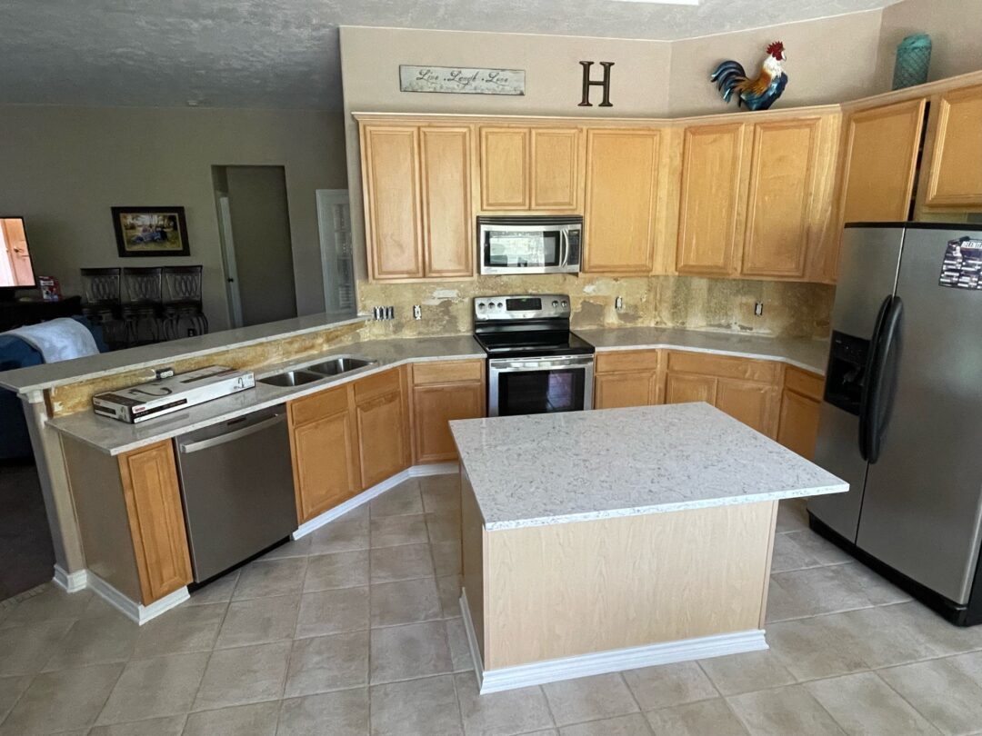 neutral colored kitchen with quartz countertop island