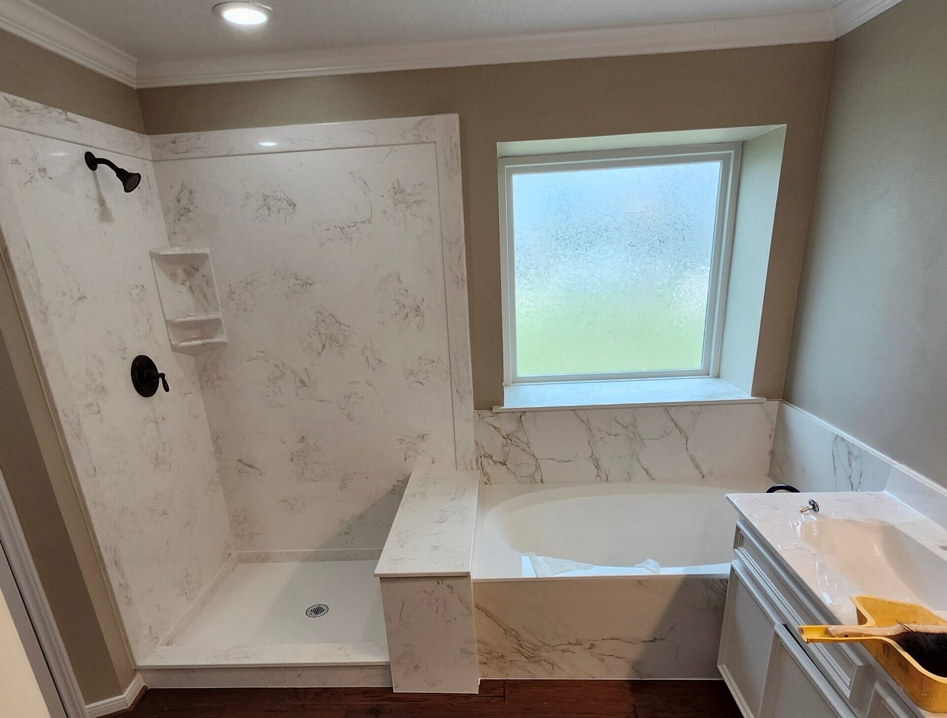 Cast Polymer Bathtubs & Cultured Products Are a Smart Choice New cultured marble tub and shower installation in a modern bathroom.