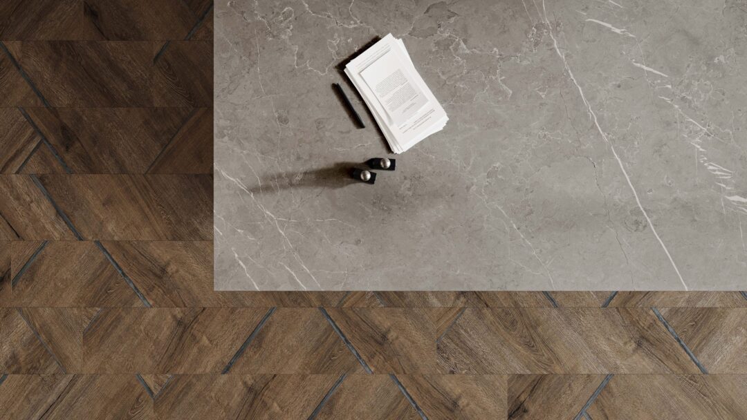 Matte Porcelain Countertops: Durable, Stylish Surfaces Top down view rendered image of a gray porcelain countertop with documents and pens with a dark floor underneath.