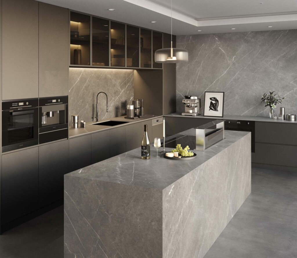 A modern kitchen with gray porcelain countertops and island.