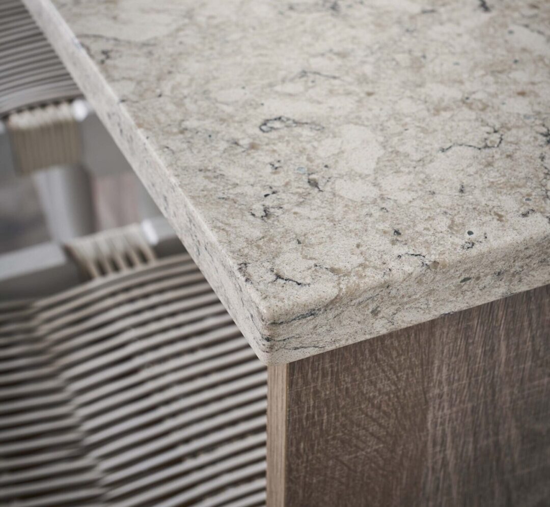 Close up of the corner of an eased edge quartz countertop in a modern kitchen.