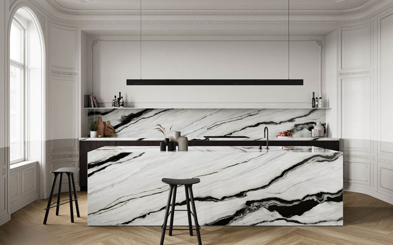 A white porcelain backsplash and island with black veining for a modern ktichen.