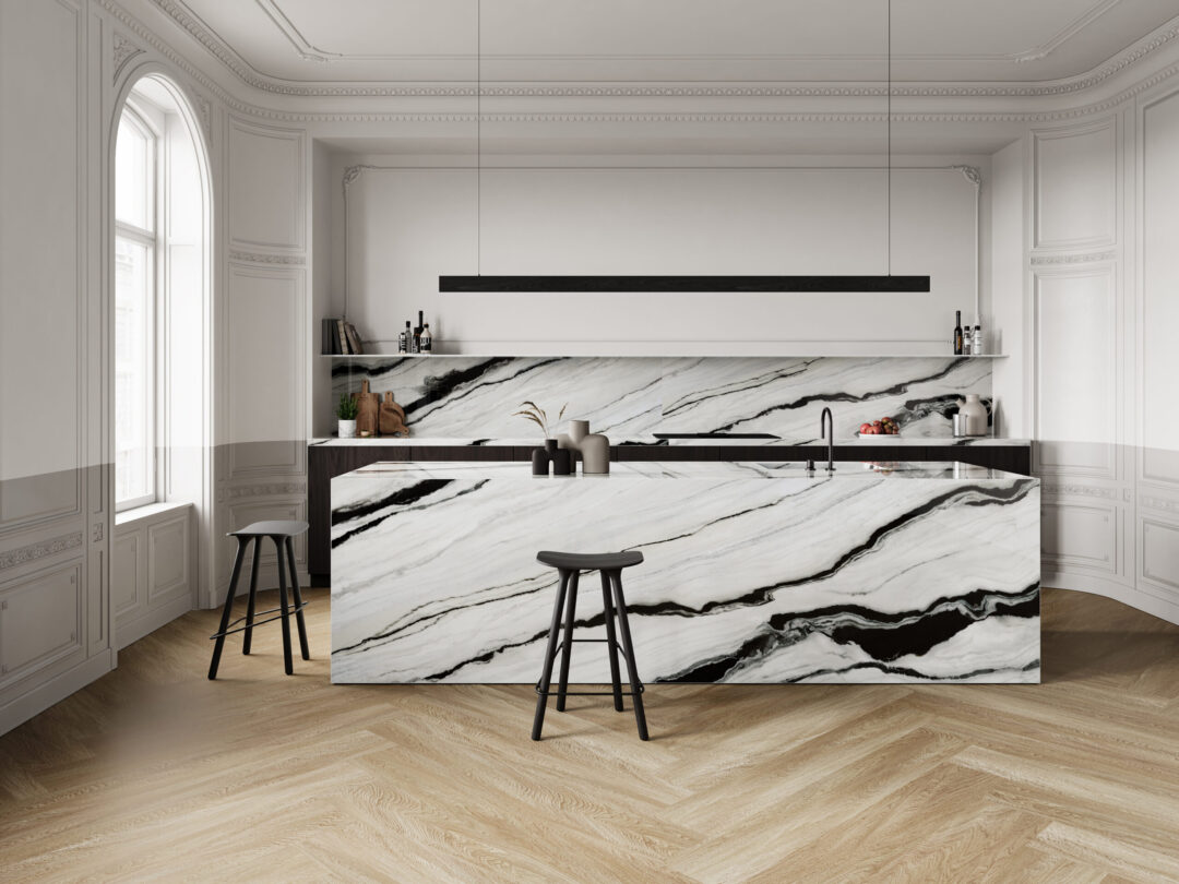 Luxury kitchen with a black and white porcelain island and matching countertop backsplash.