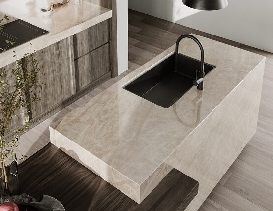 A beautiful clean porcelain countertop modern kitchen island with Teracanto by LX Hausys in the style Taj Mahal